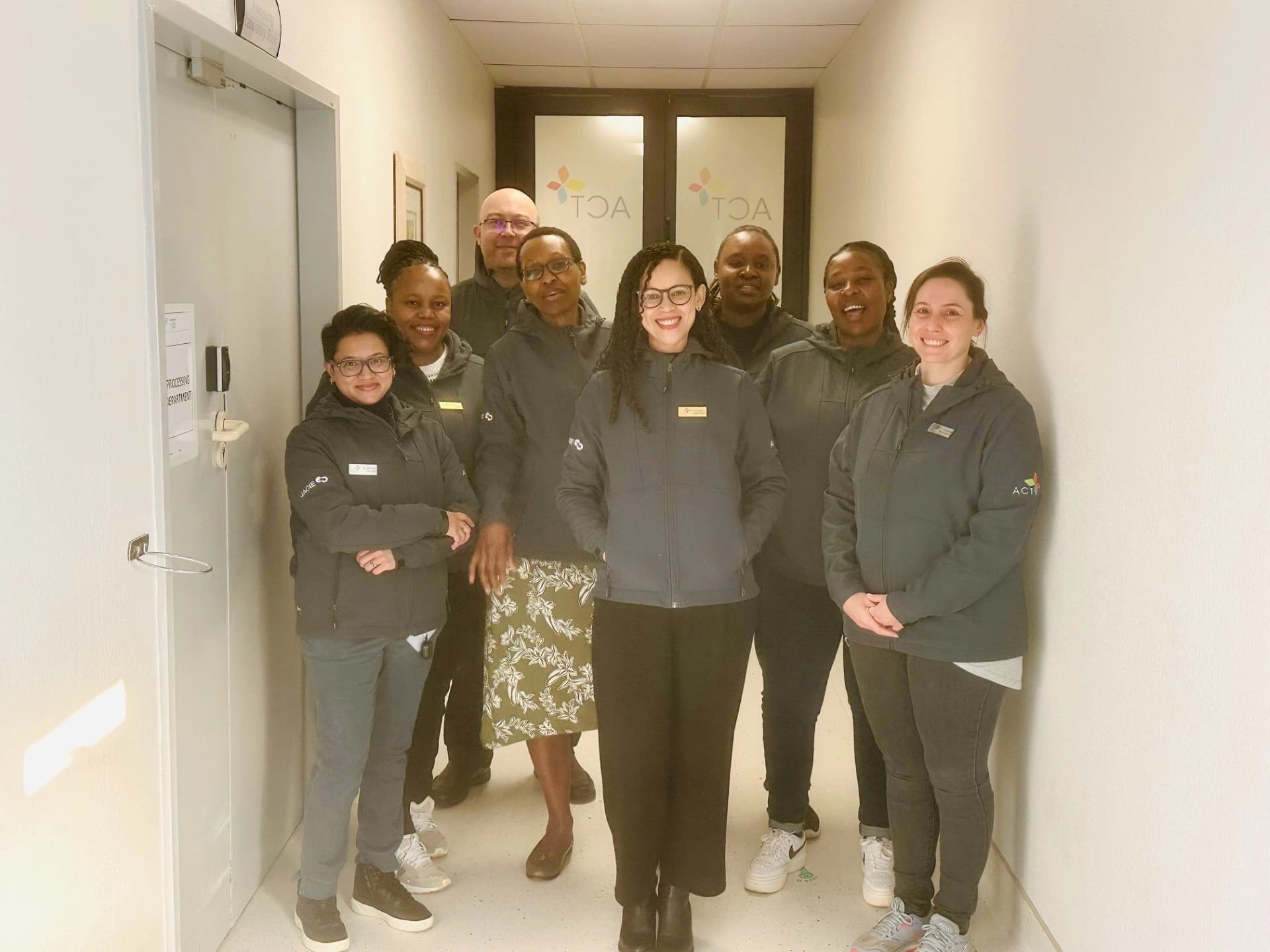 HERoeS HOME team member with a multidisciplinary care team in a hospital corridor