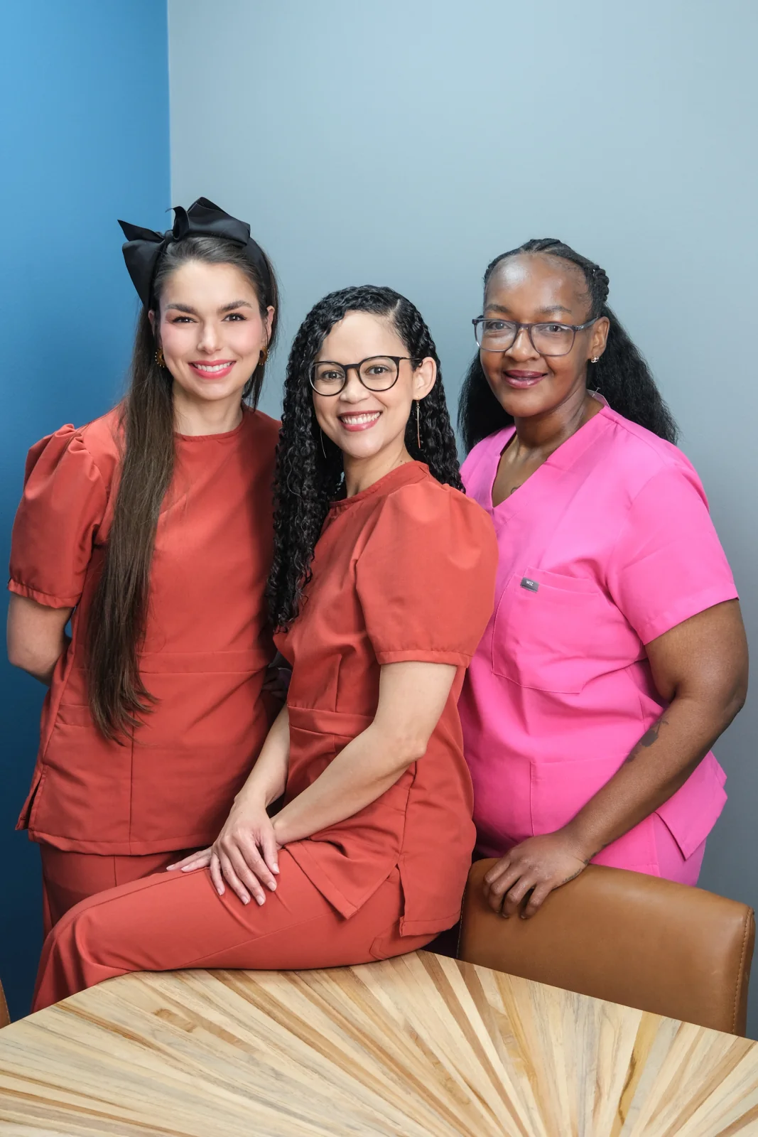 Three HERoeS HOME team members smiling together